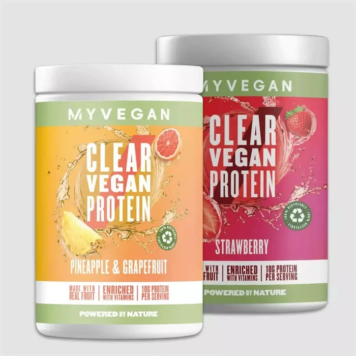 The clear whey variety pack on a podium showcasing various flavours including cranberry & raspberry and orange mango next to a Myprotein branded shaker.